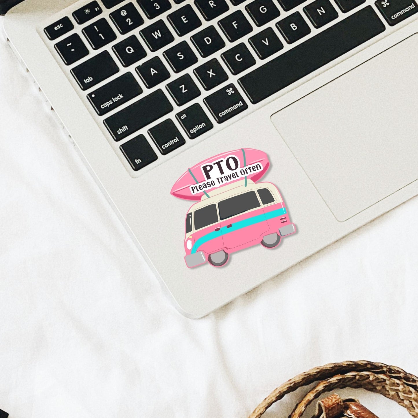 camper van sticker with the quote 'PTO please travel often' on a laptop
