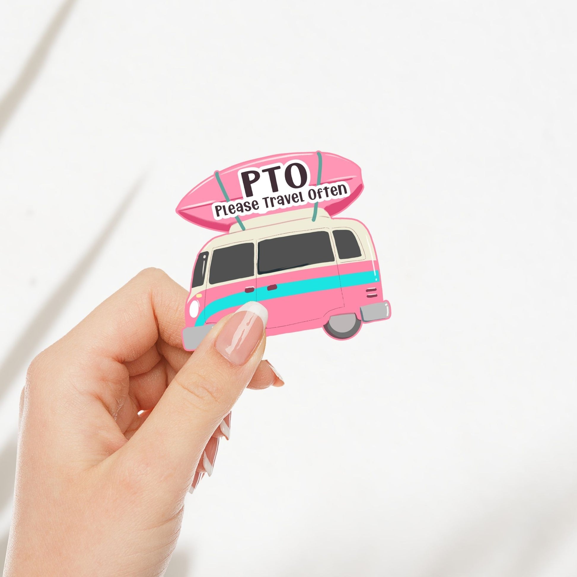 A woman's hand holding a camper van sticker with the quote 'PTO please travel often'