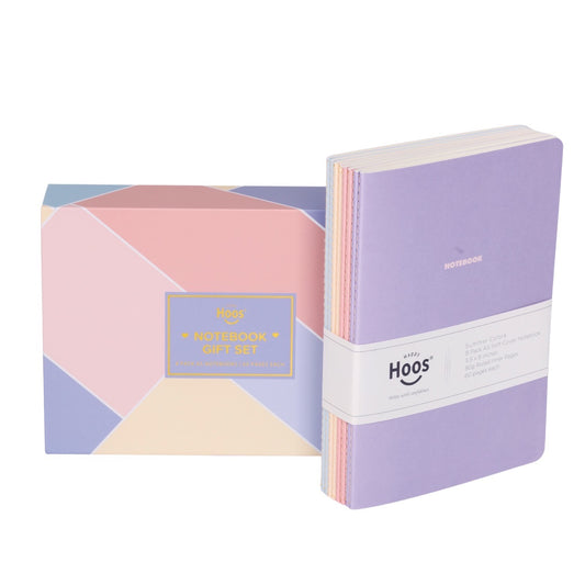 Set of 8 summer notebooks with geometric design packaging on a white background