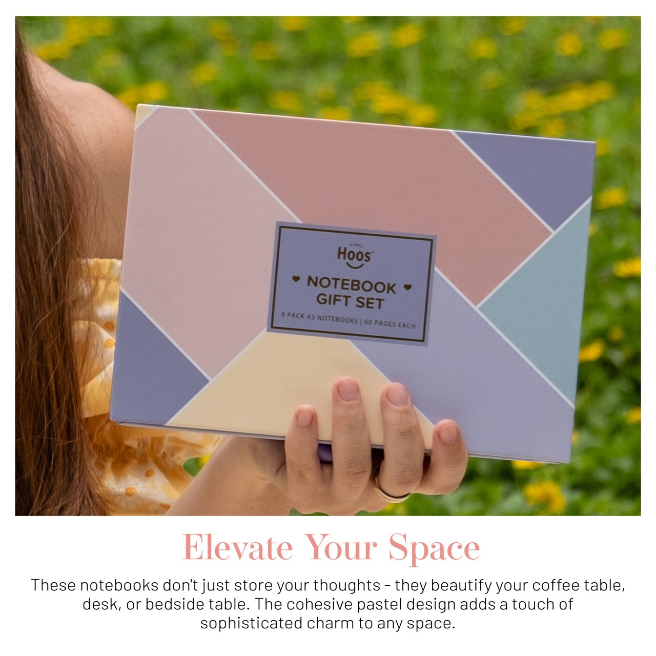 Person holding a geometric notebook gift set with 'Hoos' branding against a blurred natural background.