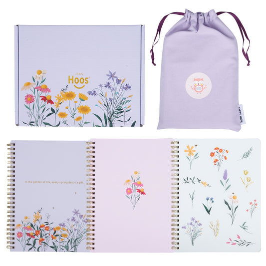 Floral notebooks with a drawstring bag and a box on a white background