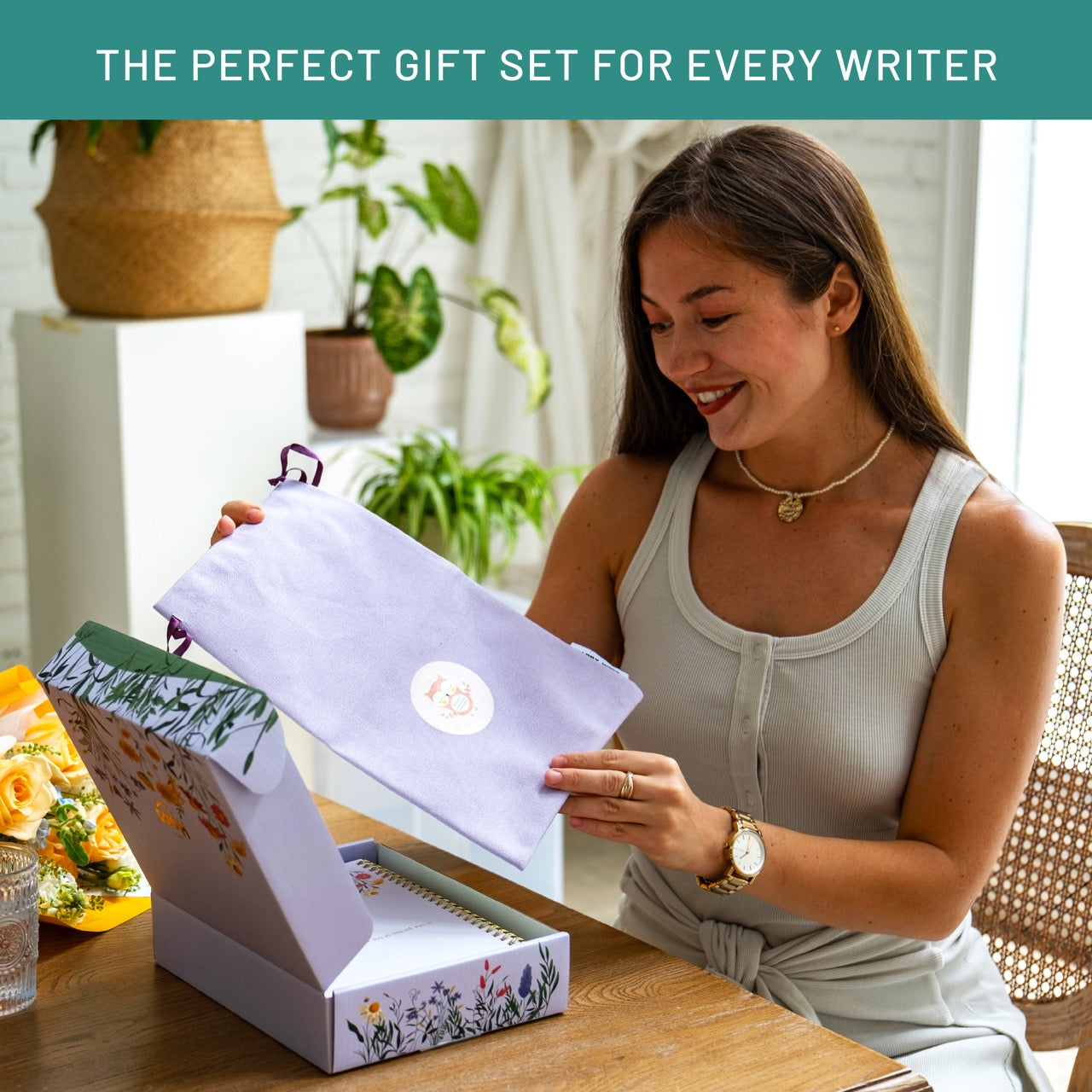 Woman opening a gift box with a product inside, surrounded by plants and a vase.