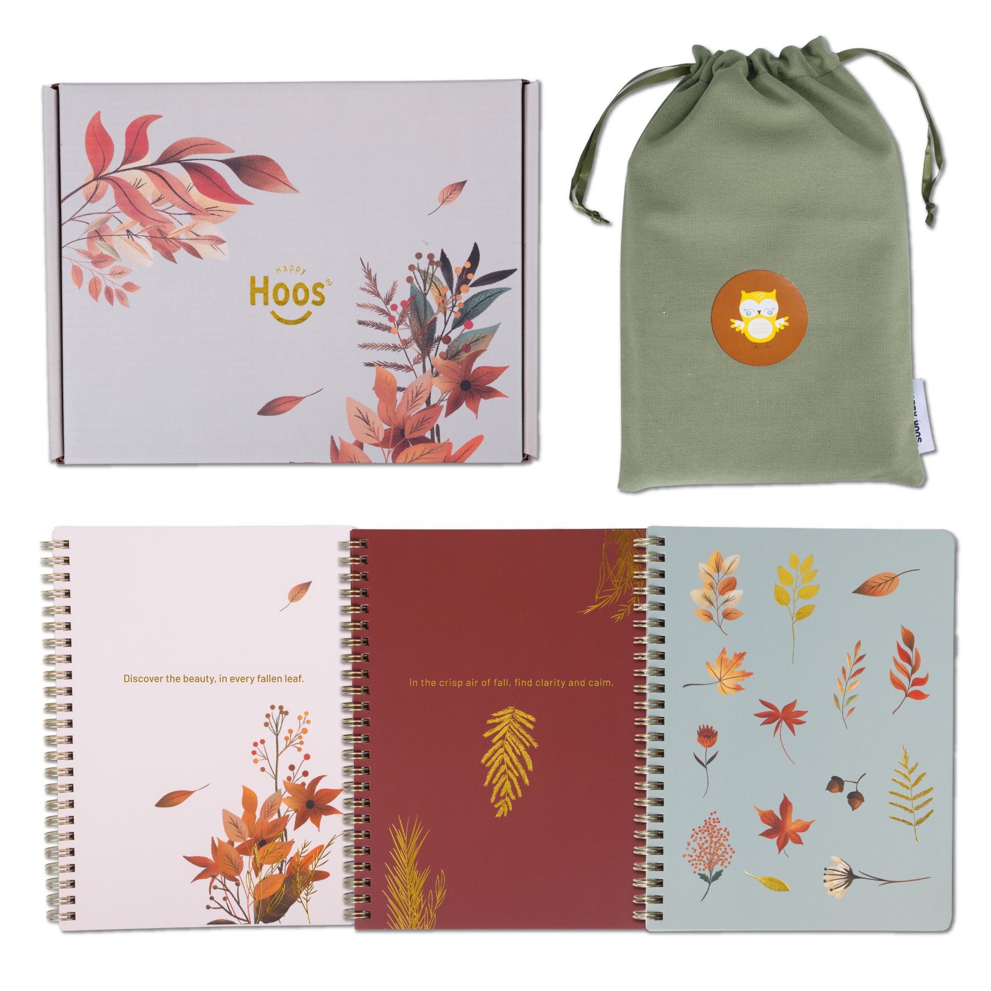 Set of notebooks with autumn leaf designs and a green drawstring bag with a logo.