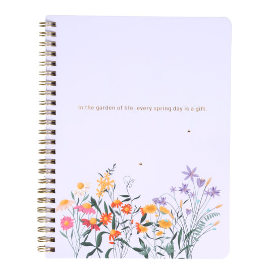 Notebook with floral design and text on a white background