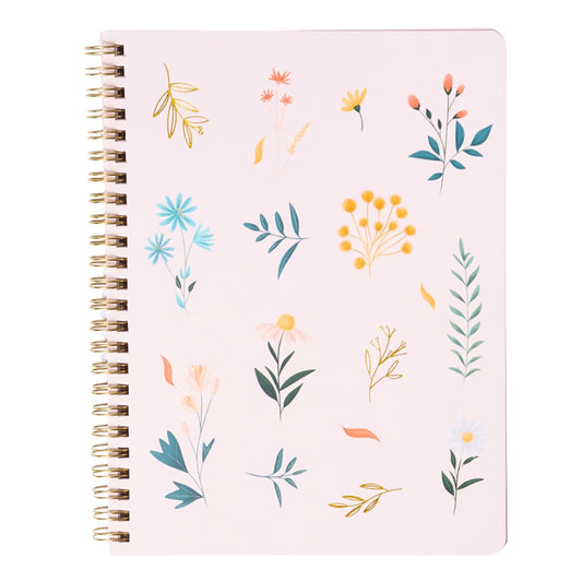 Notebook with floral patterns on a pink background