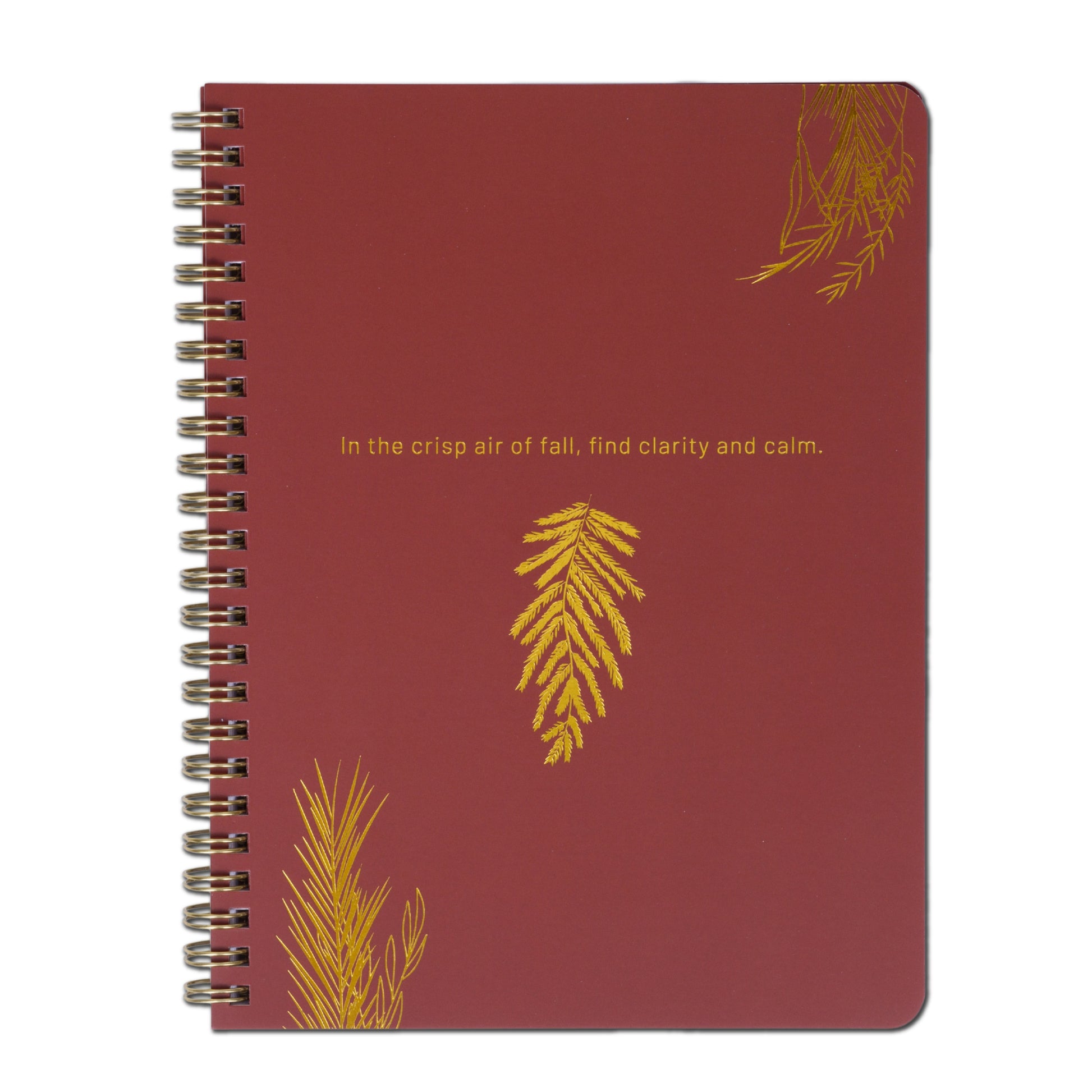 Red notebook with gold leaf designs and text on a white background