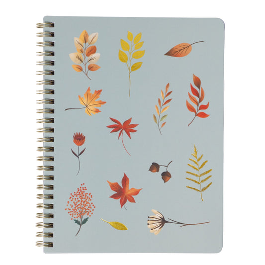 Notebook with autumn leaf design on a light blue background