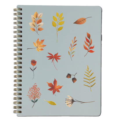 Notebook with autumn leaf design on a light blue background