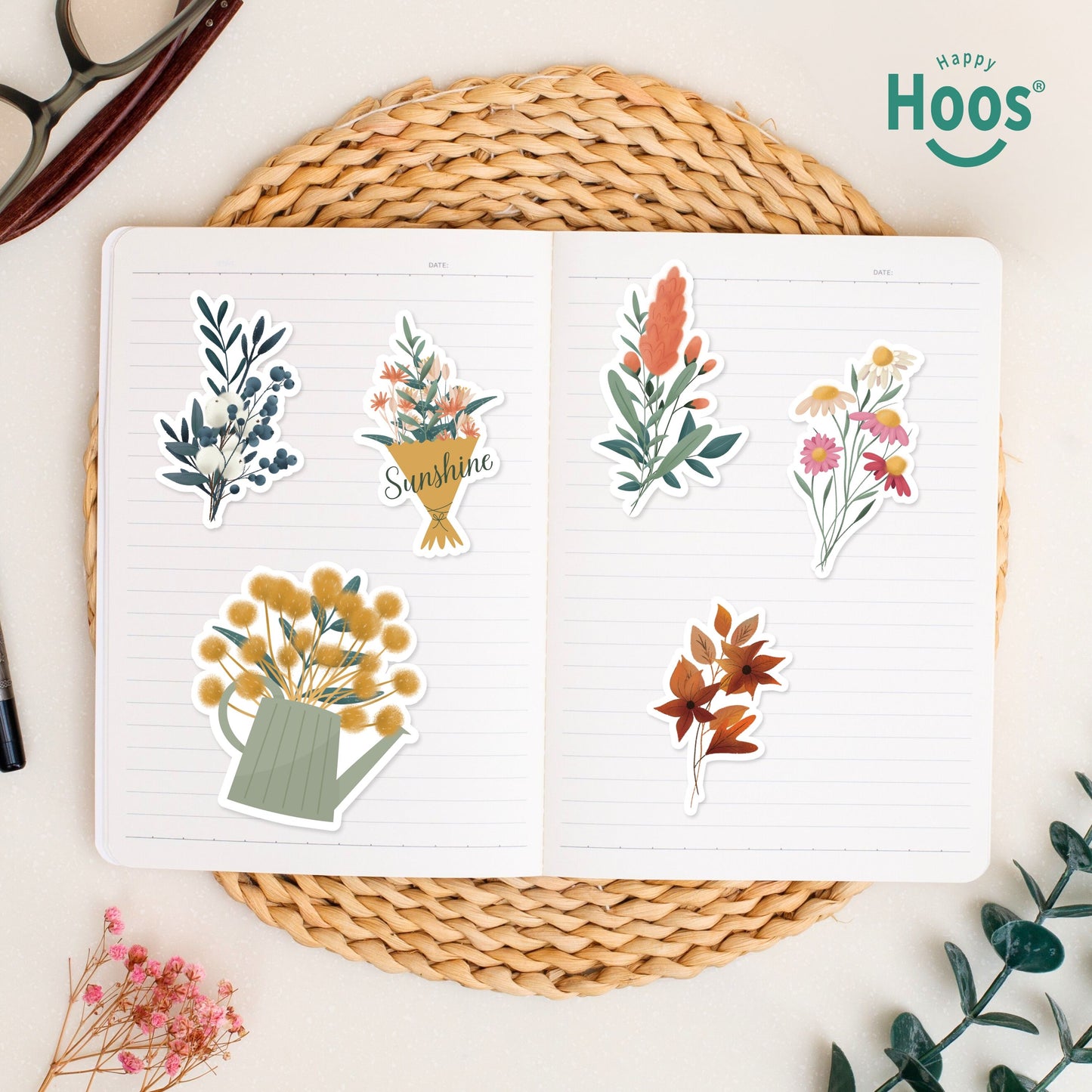 Botanical Florals stickers on open journal: winter botanical with berries, flower bouquet with "Sunshine", yellow flowers in watering can, coral botanical stem, colorful wildflower bouquet, orange autumn leaves