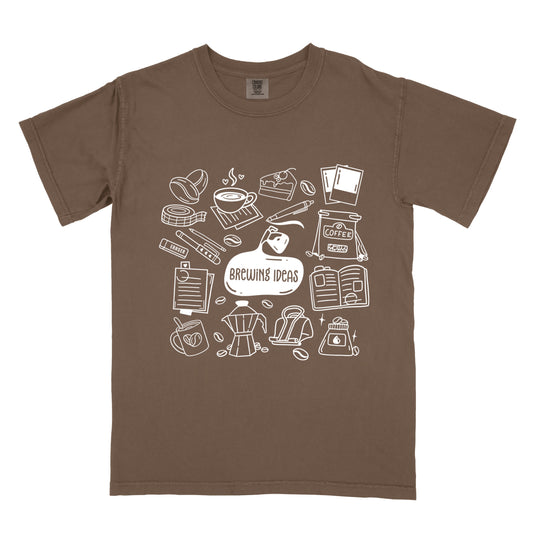 Brown t-shirt with white coffee-themed graphics and 'Brewing Ideas' text on a white background