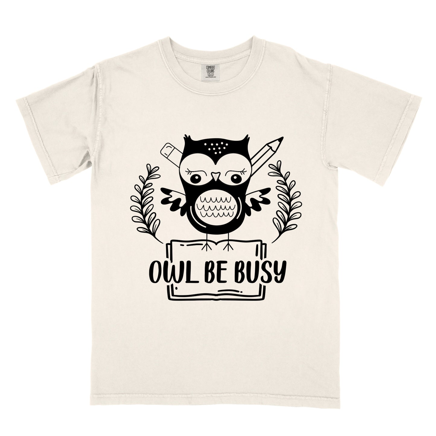 a beige t-shirt with an owl graphic and 'OWL BE BUSY' text.
