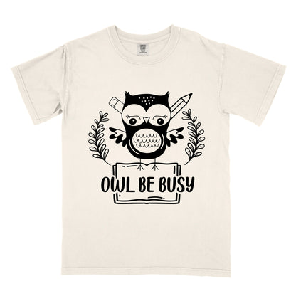 a beige t-shirt with an owl graphic and 'OWL BE BUSY' text.