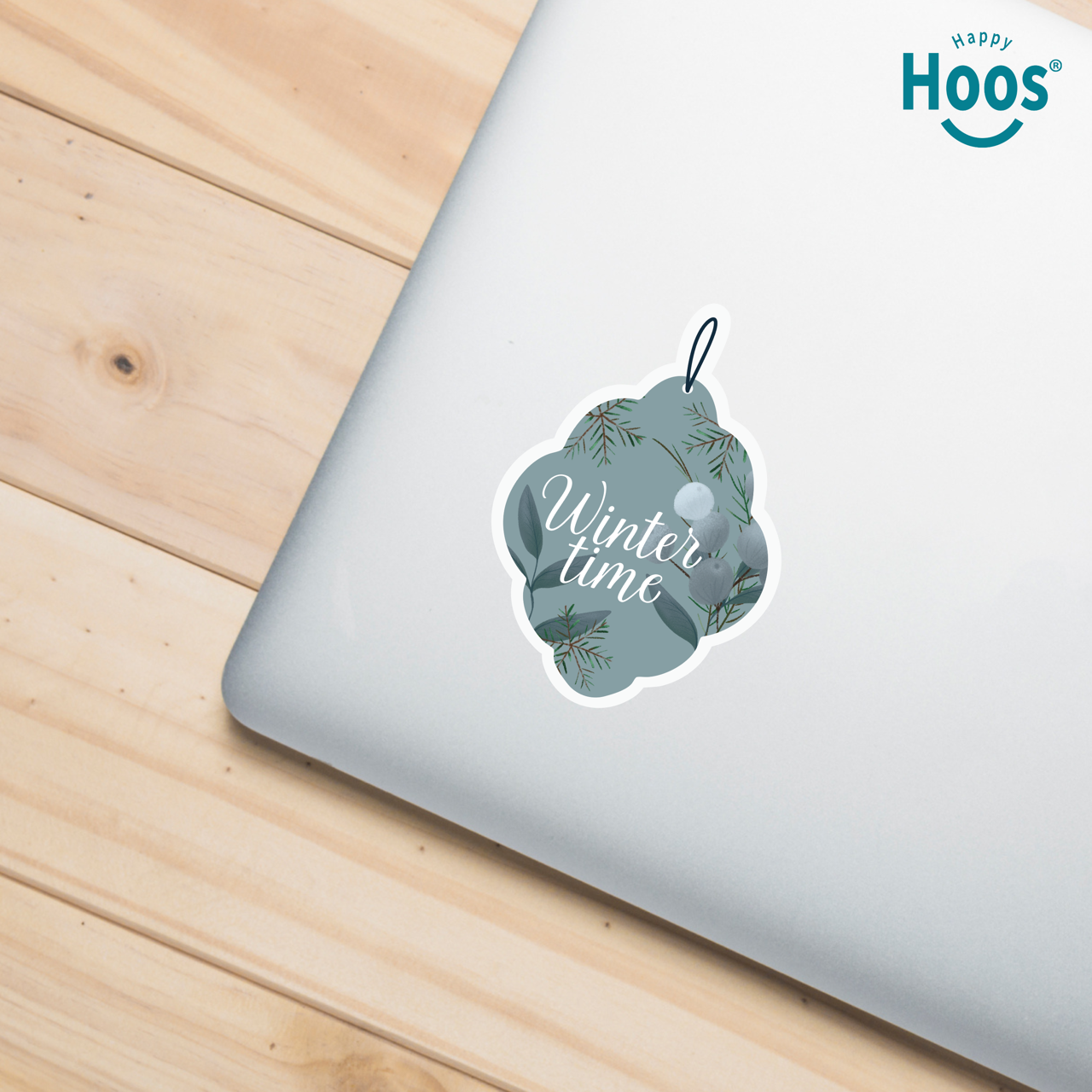 Winter Ornament Sticker with 'Winter time' text on a laptop