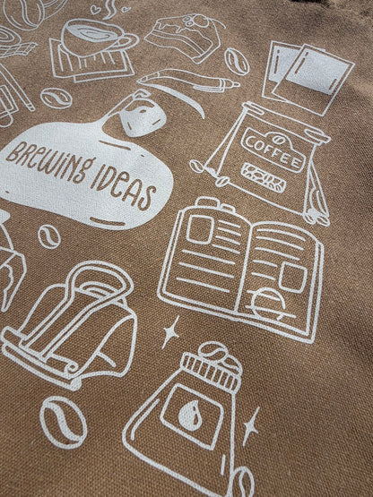 Brown fabric with white line art illustrations of coffee-related items and 'Brewing Ideas' text.