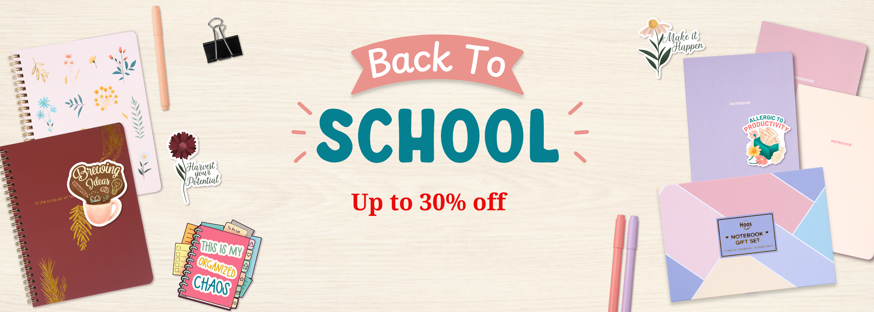 Back to School promotional banner with a light wood background, featuring colorful stationery items such as notebooks, envelopes, sticky notes, and pens, with large text reading 'Back To SCHOOL' and 'Up to 30% off'.