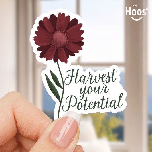 Sticker with a maroon flower and 'Harvest your Potential' text held by a hand.