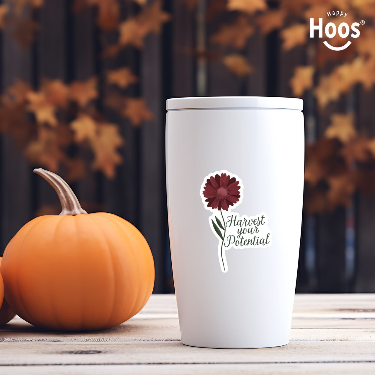 White tumbler with Harvest Your Potential sticker featuring a deep burgundy gerbera daisy with detailed petals and green stem and leaves, with dark script lettering reading "Harvest your Potential" beside the flower, measuring 2.5 by 3.5 inches