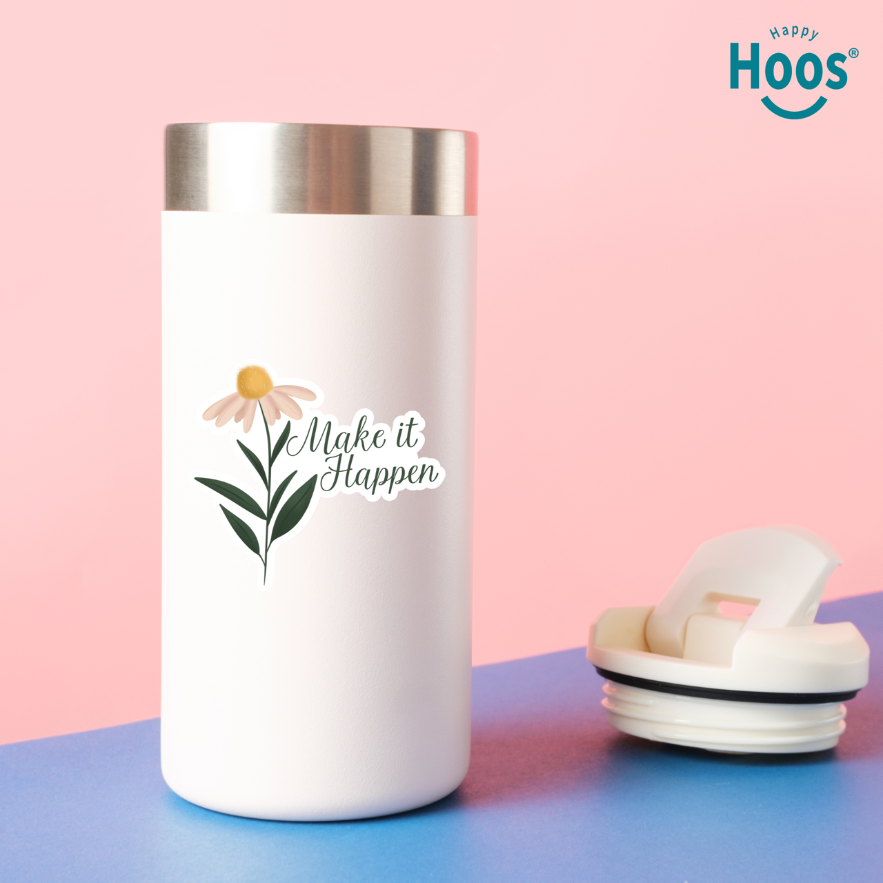 White tumbler with floral design and 'Make it Happen' text on a pink and blue background, featuring the brand 'Happy Hoos'.