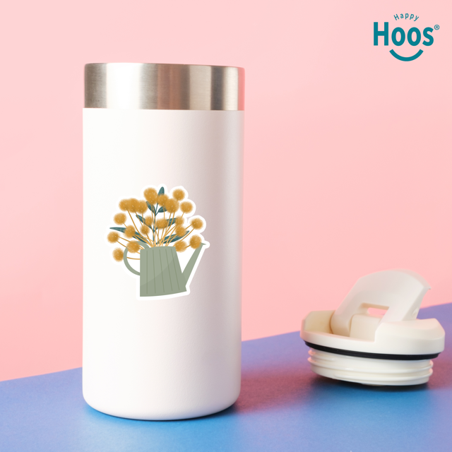 White tumbler with floral design on a pink and blue background, featuring the 'Happy Hoos' brand.