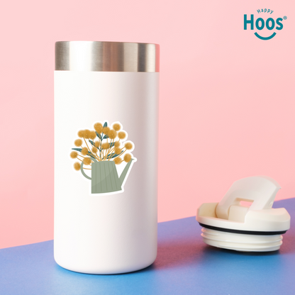 White tumbler with floral design on a pink and blue background, featuring the 'Happy Hoos' brand.