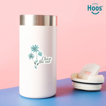 White tumbler with floral design and text on a pink and blue background, featuring the 'Happy Hoos' brand.