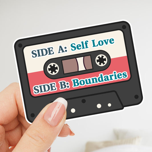 Cassette tape design with 'Side A: Self Love' and 'Side B: Boundaries' text held by a hand.